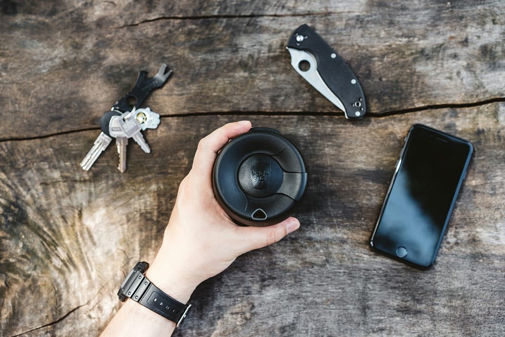 a hand holding a camera