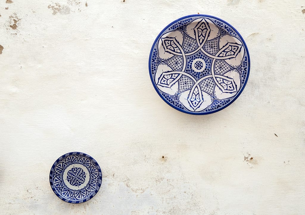 two white-and-blue ceramic dinnerware - consommation responsable