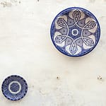 two white-and-blue ceramic dinnerware