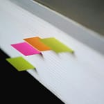 shallow focus photography of green, pink, and orange bookmarks