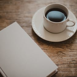 white ceramic cup on white ceramic saucer