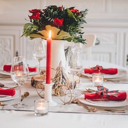 red and yellow flower bouquet on table