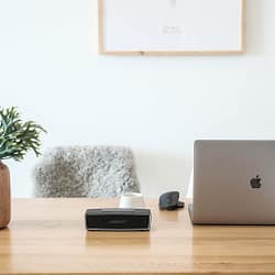 macbook pro on brown wooden table