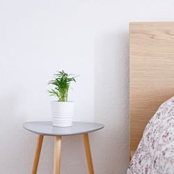 white ceramic pot on gray and brown wooden table